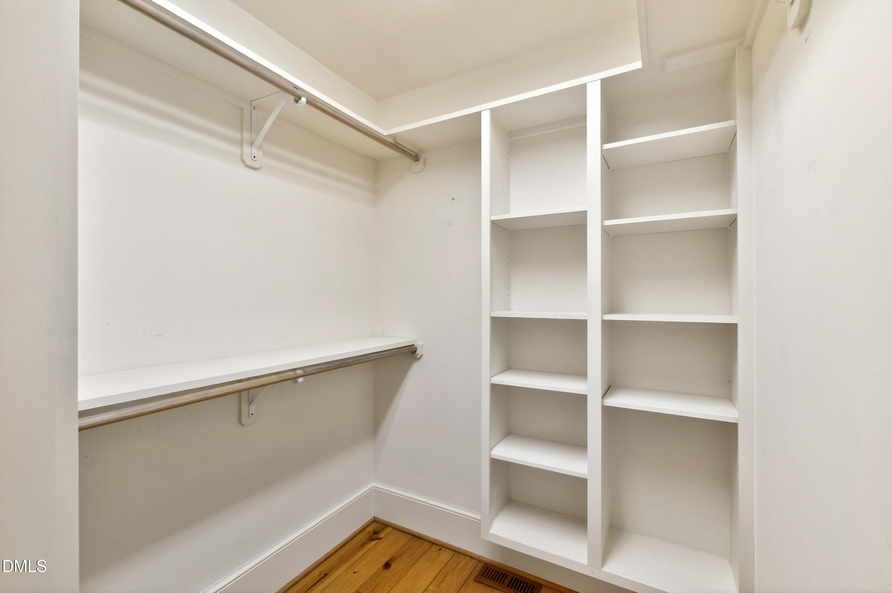 2111 Cook Ridge Court Raleigh, NC 27615 - Photo 37 of 83 a view of walk in closet with empty racks