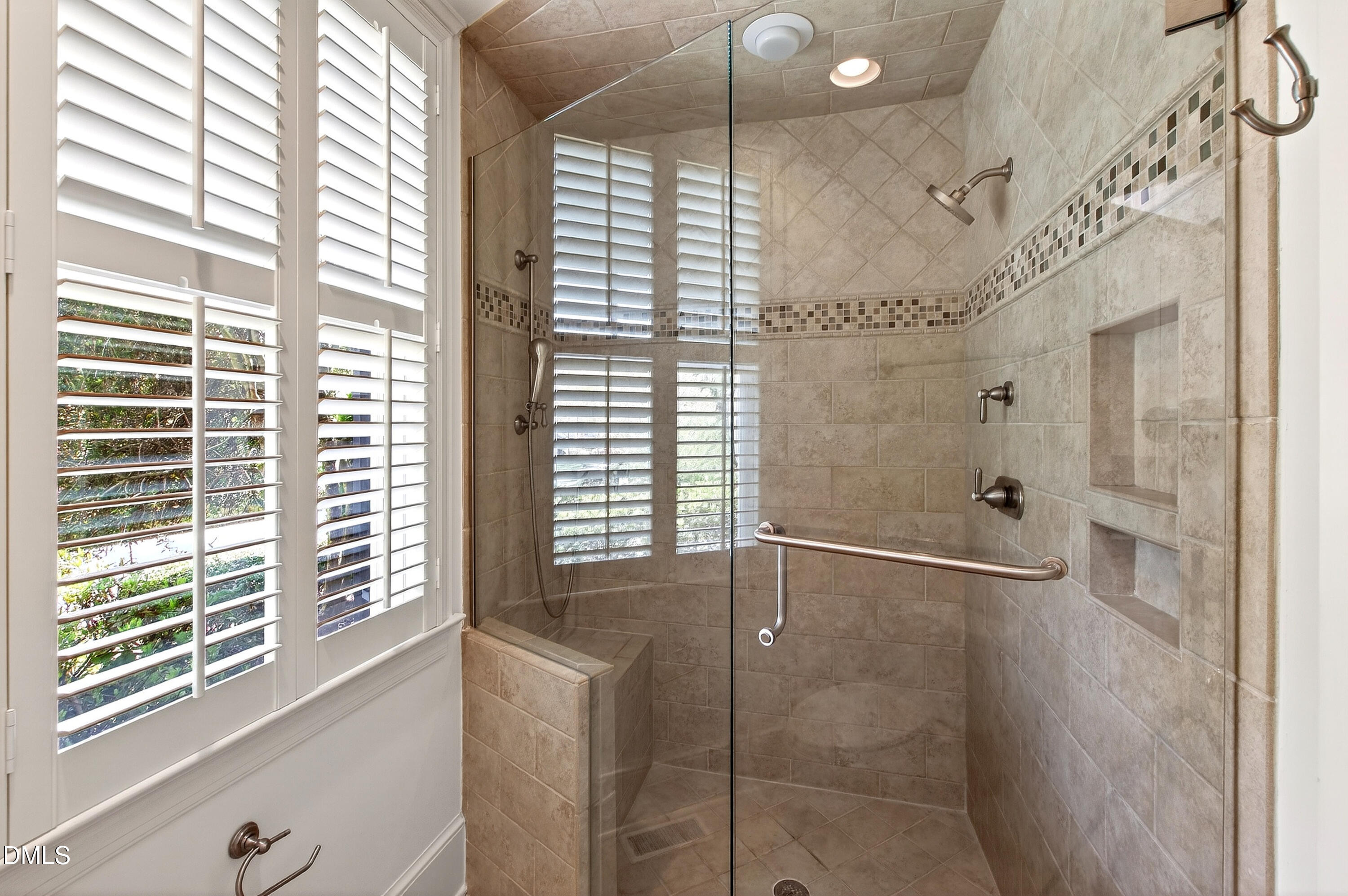 2111 Cook Ridge Court Raleigh, NC 27615 - Photo 39 of 83 a bathroom with a shower and a large window