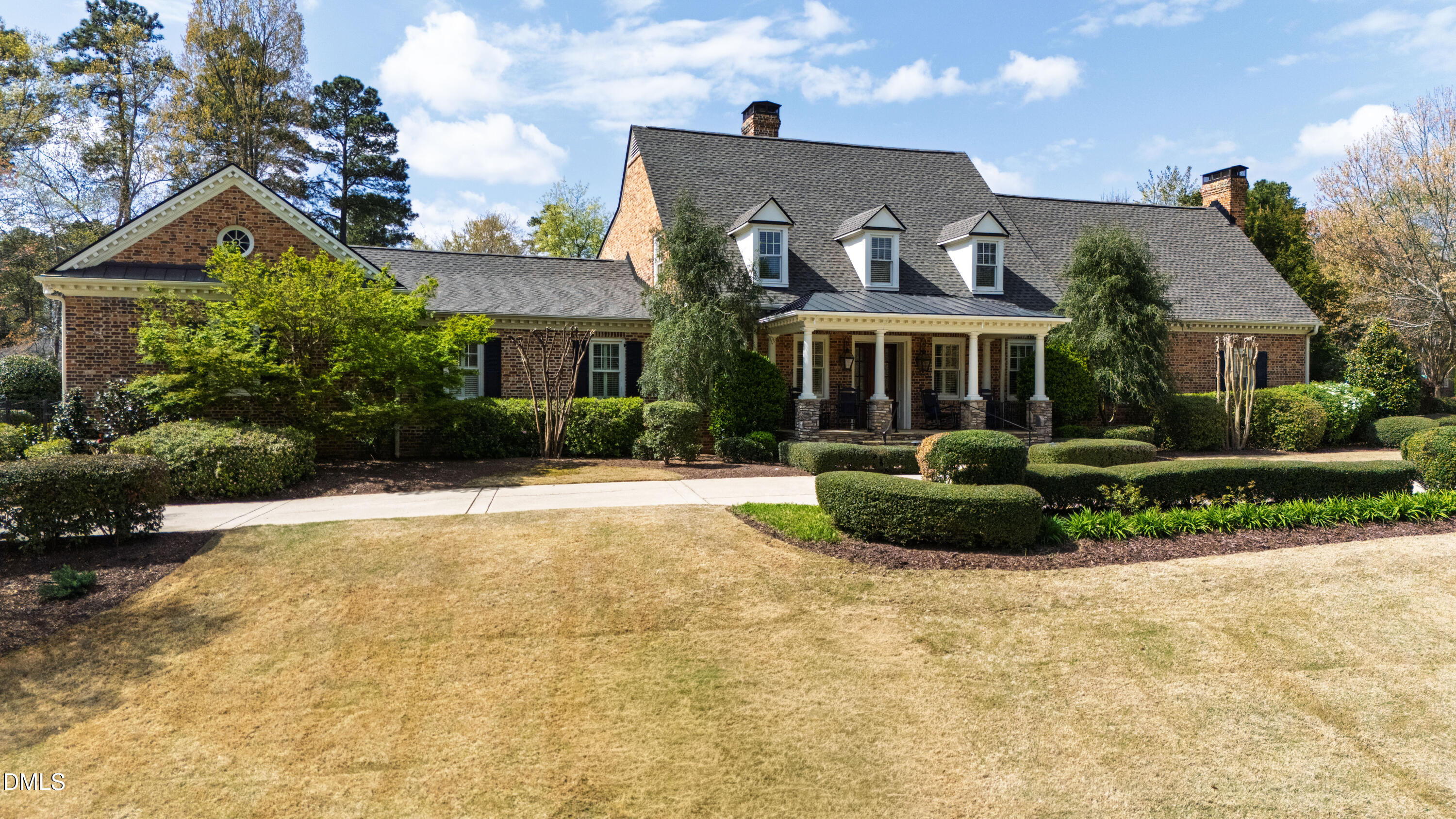 2111 Cook Ridge Court Raleigh, NC 27615 - Photo 3 of 83 a front view of a house with a garden