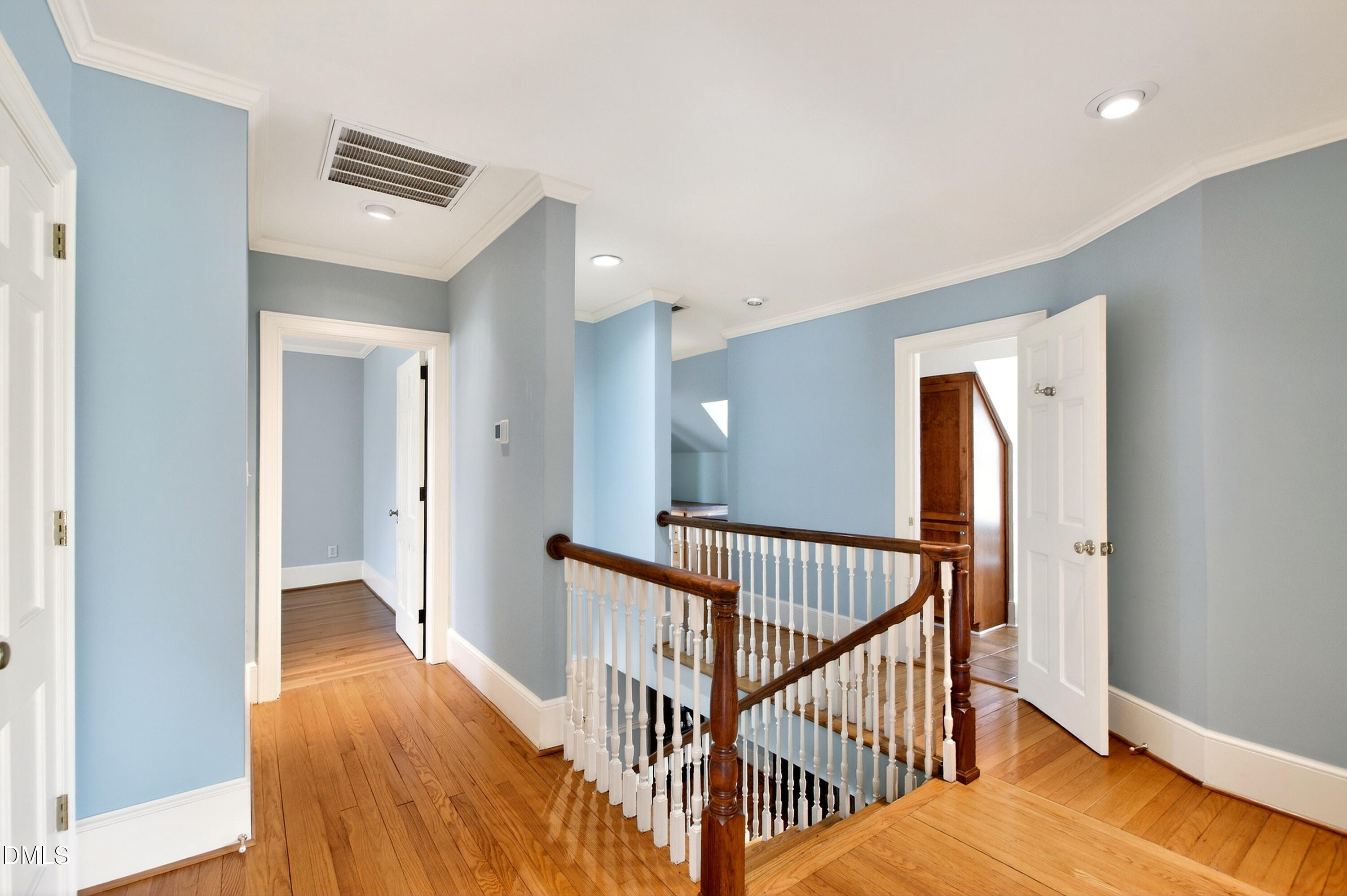 2111 Cook Ridge Court Raleigh, NC 27615 - Photo 50 of 83 a view of a hallway with a chandelier