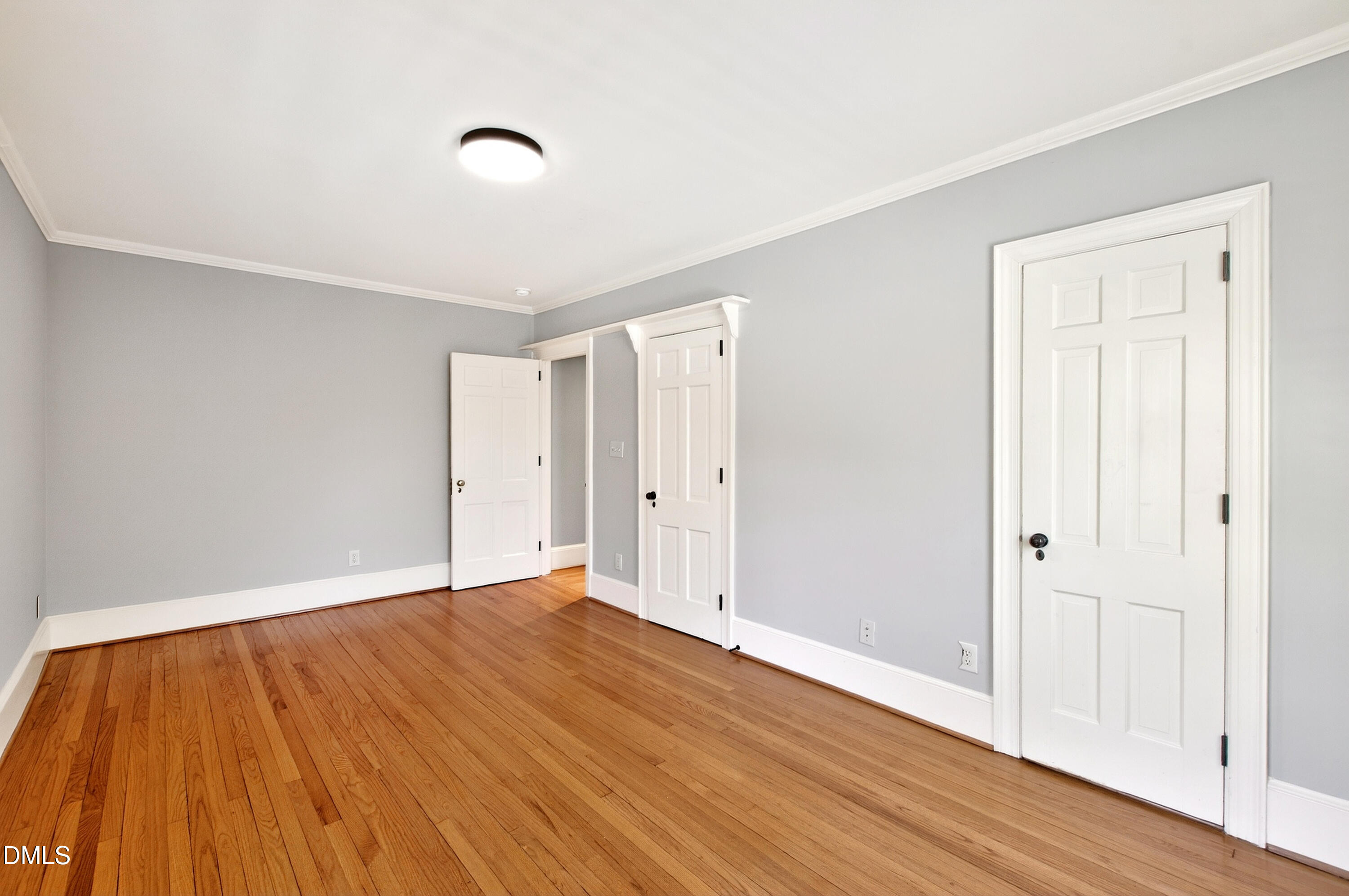 2111 Cook Ridge Court Raleigh, NC 27615 - Photo 58 of 83 a view of an empty room with wooden floor