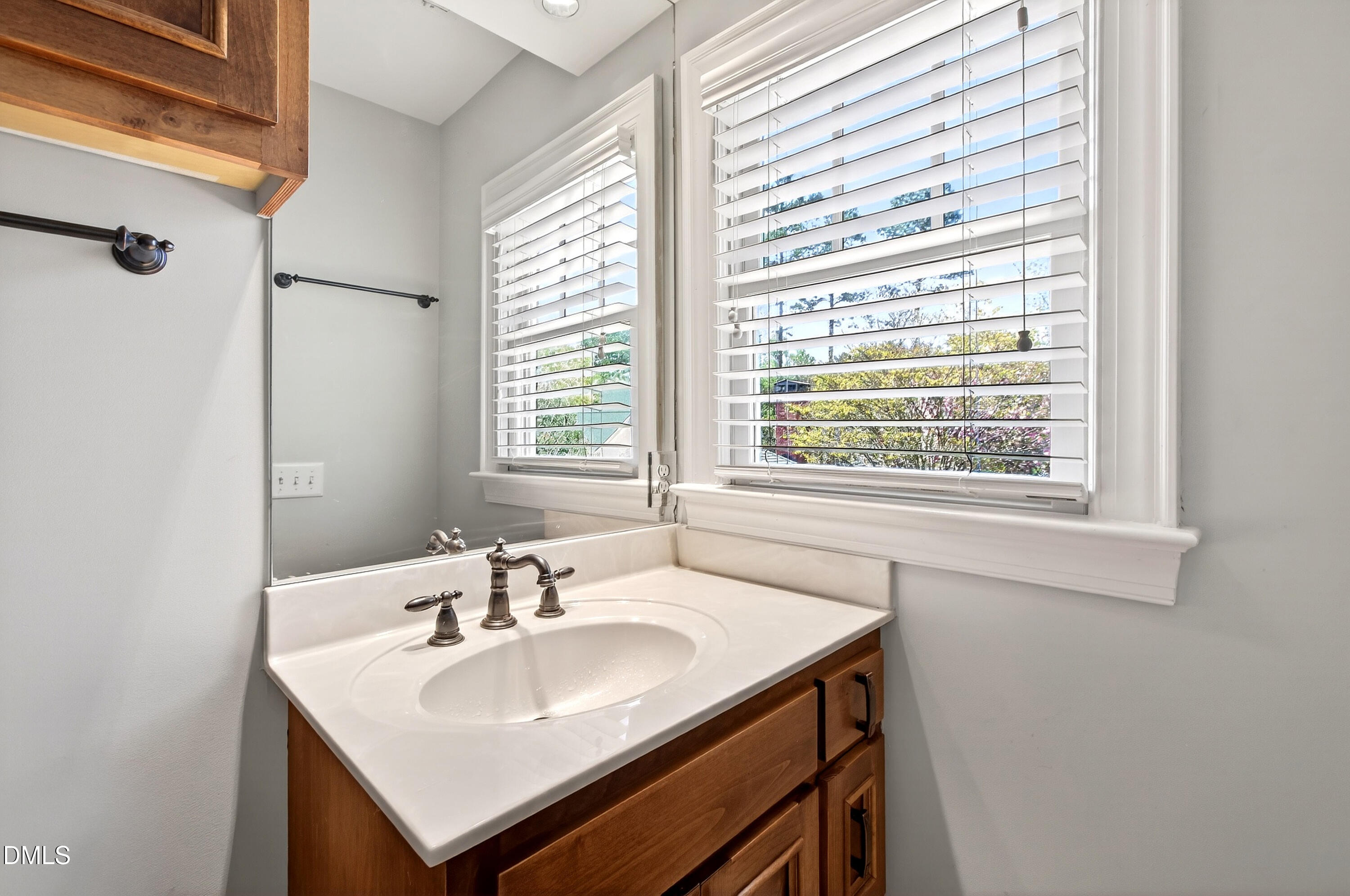 2111 Cook Ridge Court Raleigh, NC 27615 - Photo 59 of 83 a bathroom with a sink and a window