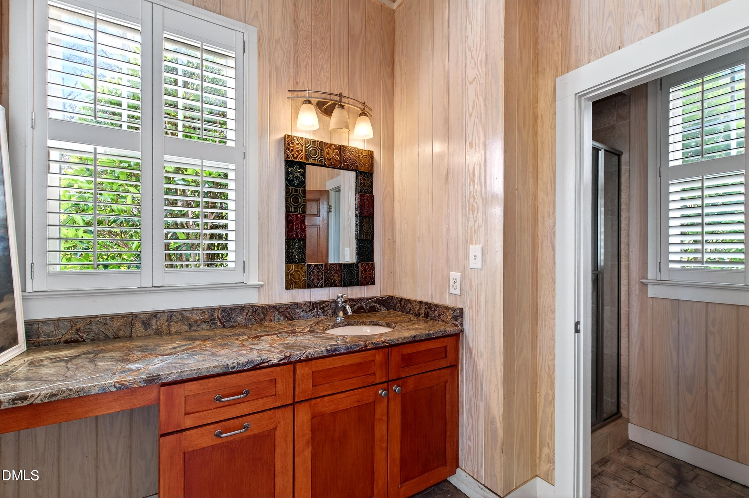 2111 Cook Ridge Court Raleigh, NC 27615 - Photo 72 of 83 a bathroom with a granite countertop sink and a window