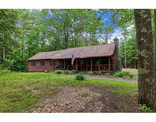 105 Sherbert Road Ashburnham, MA 01430 - Photo 2 of 32 a view of a big house in a big yard with large trees