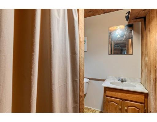 105 Sherbert Road Ashburnham, MA 01430 - Photo 25 of 32 a bathroom with a sink and a mirror