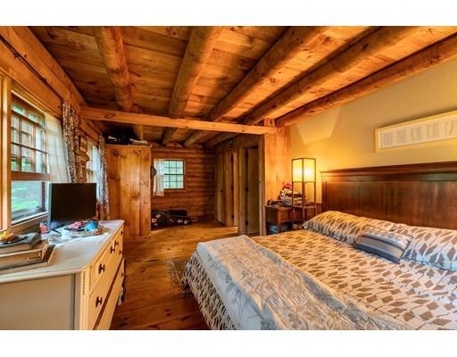 105 Sherbert Road Ashburnham, MA 01430 - Photo 27 of 32 a bedroom with a bed and wooden floor