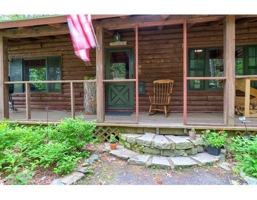 105 Sherbert Road Ashburnham, MA 01430 - Photo 29 of 32 a view of a chair and table in the back yard of the house