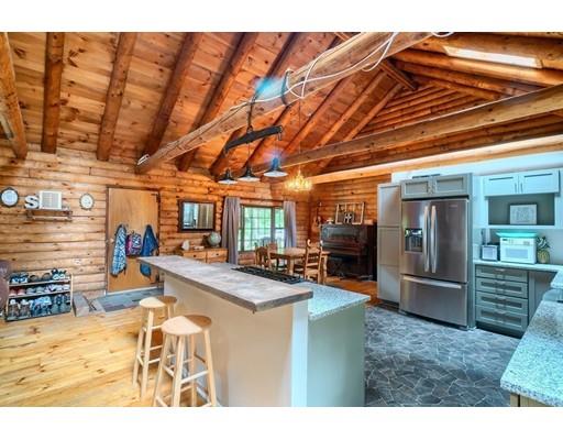 105 Sherbert Road Ashburnham, MA 01430 - Photo 7 of 32 a dining hall with stainless steel appliances granite countertop a stove and cabinets