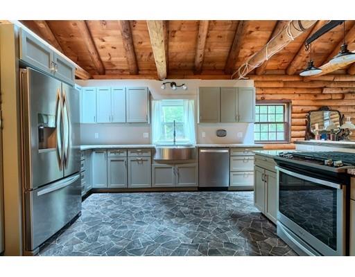 105 Sherbert Road Ashburnham, MA 01430 - Photo 8 of 32 a kitchen with stainless steel appliances kitchen island granite countertop a stove a sink and a refrigerator