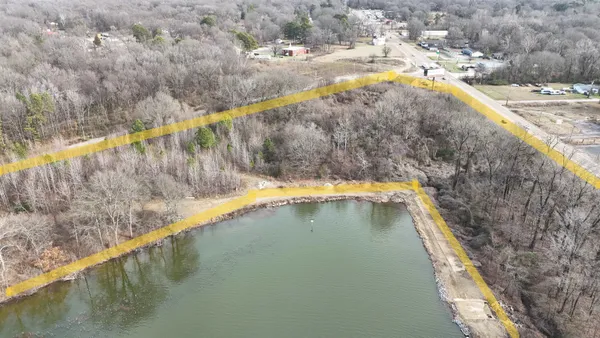 a view of swimming pool with a yard