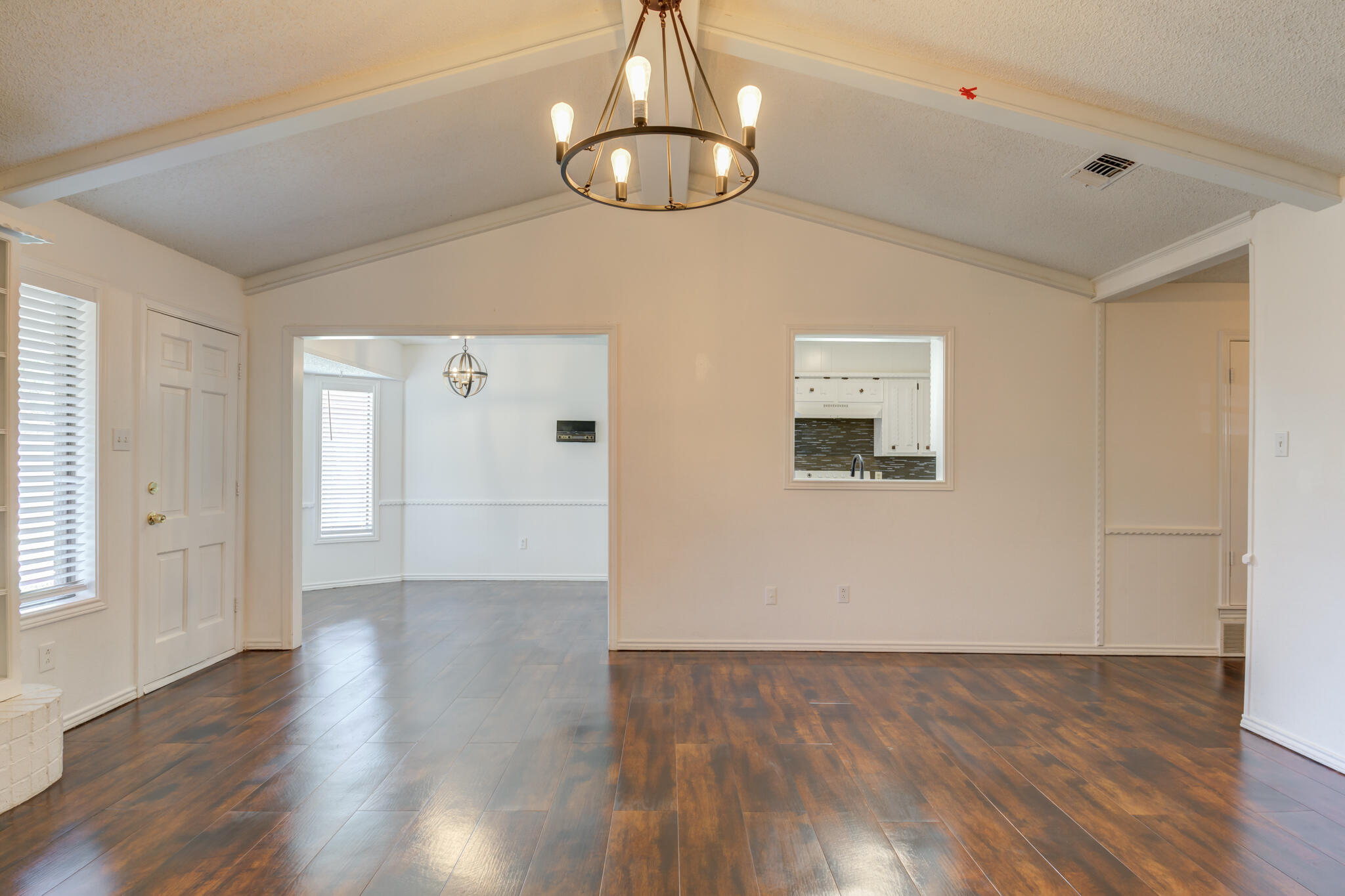 4813 73rd Street Lubbock, TX 79424 - Photo 11 of 37 a view of a livingroom with wooden floor