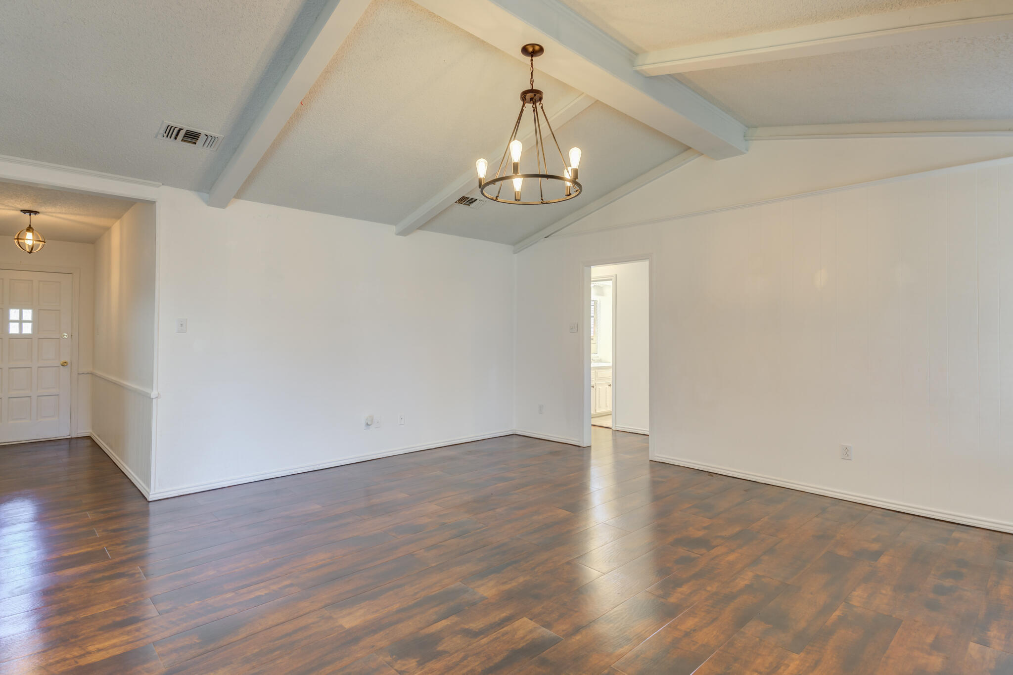 4813 73rd Street Lubbock, TX 79424 - Photo 14 of 37 wooden floor in an empty room with a window