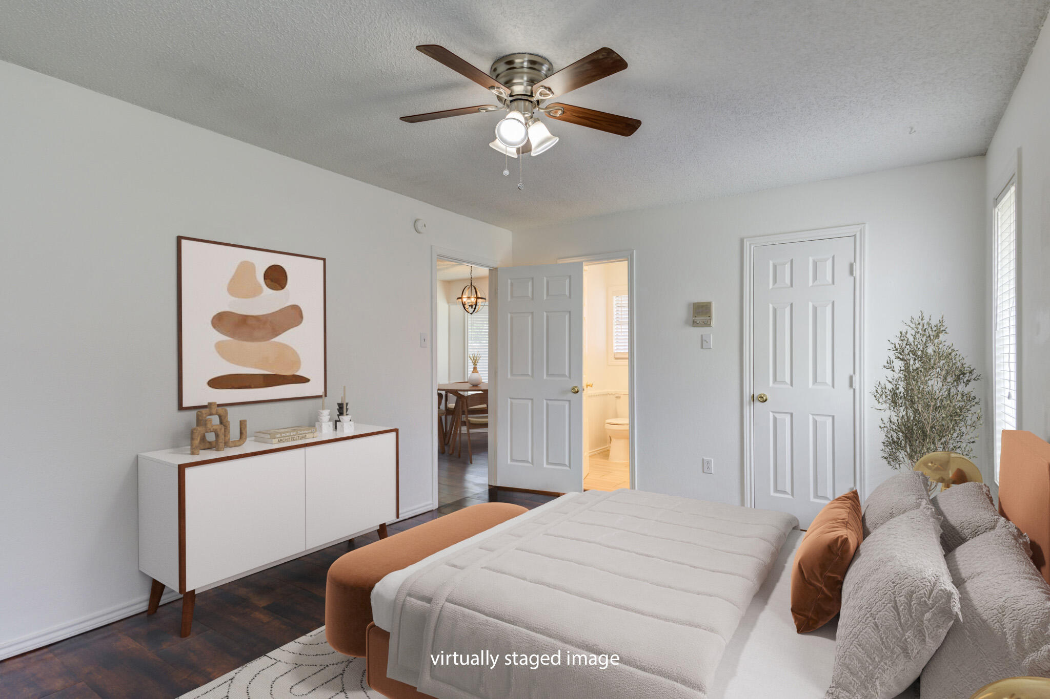 4813 73rd Street Lubbock, TX 79424 - Photo 25 of 37 a bedroom with a bed and a chandelier