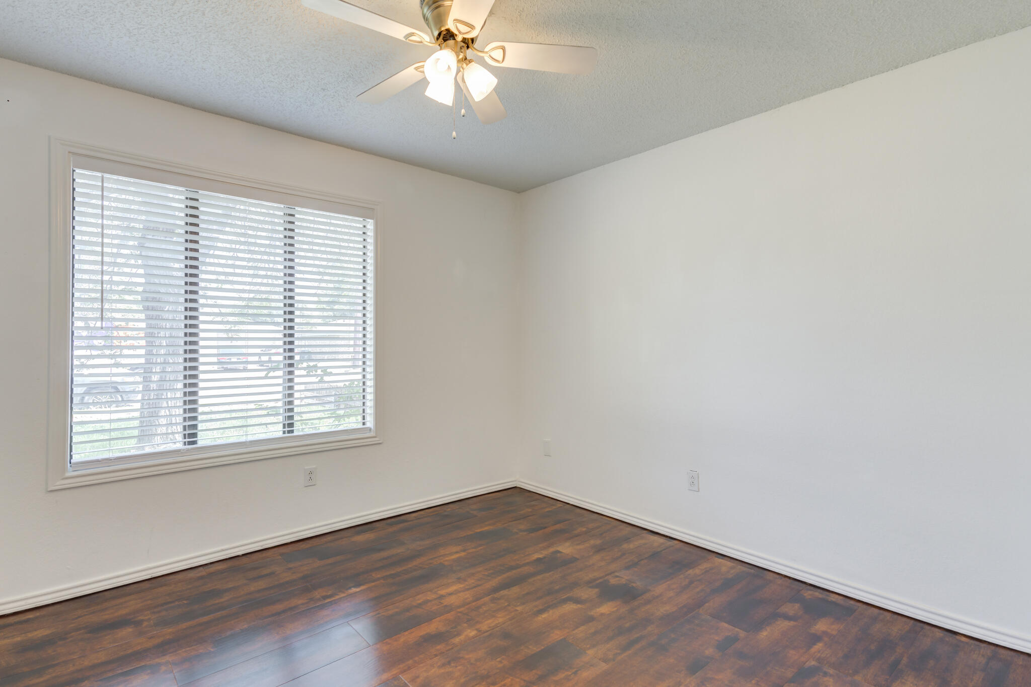 4813 73rd Street Lubbock, TX 79424 - Photo 31 of 37 an empty room with wooden floor closet and windows