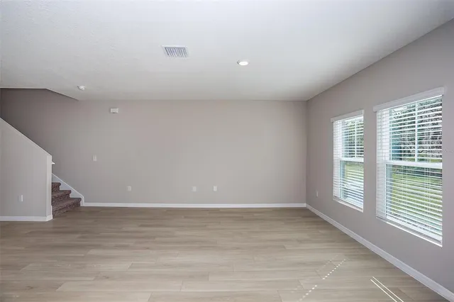 a view of an empty room with a window