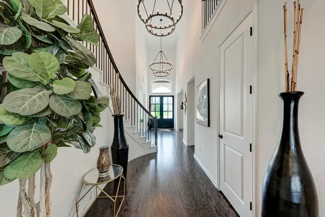 a living room with fireplace furniture and a large window