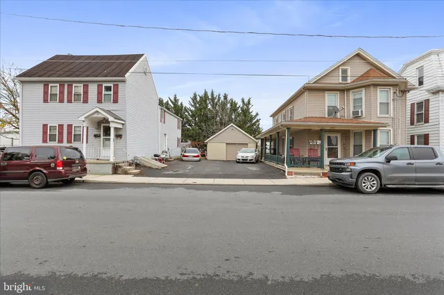 a view of a car park in front of a house