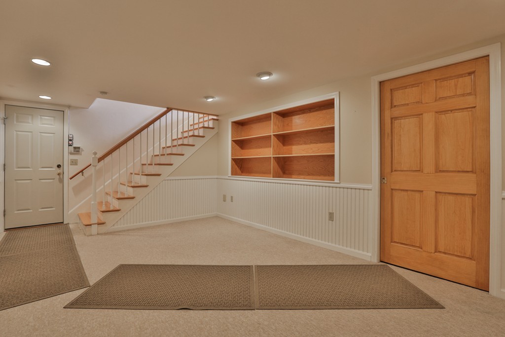 61 C Highland Road Boxford, MA 01921 - Photo 20 of 30 a view of an empty room with wooden floor and entryway