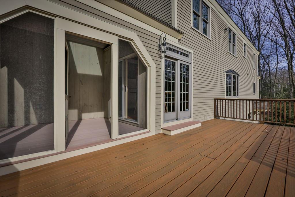 61 C Highland Road Boxford, MA 01921 - Photo 23 of 30 a view of a house with a roof deck