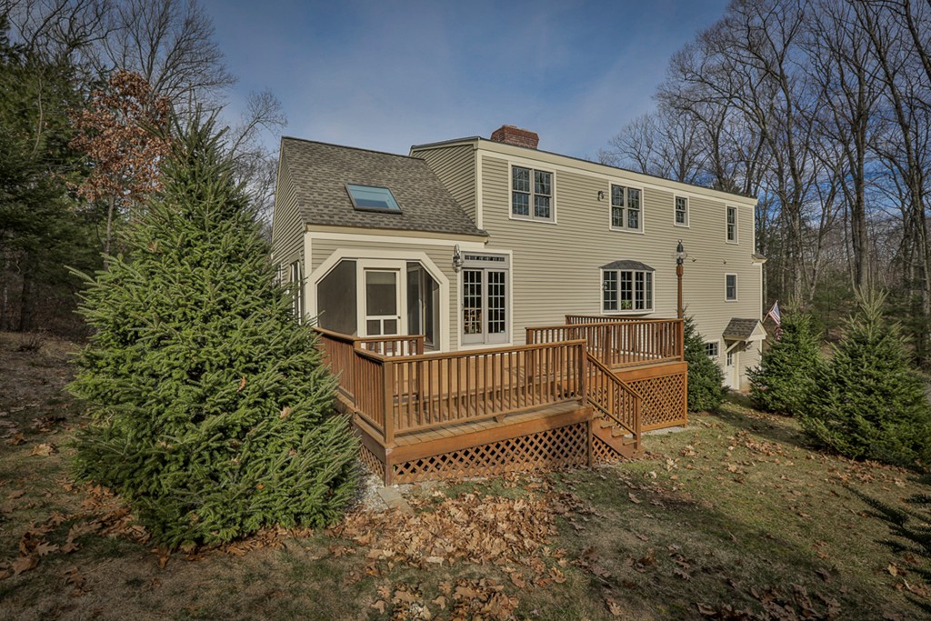 61 C Highland Road Boxford, MA 01921 - Photo 25 of 30 a front view of a house with a yard