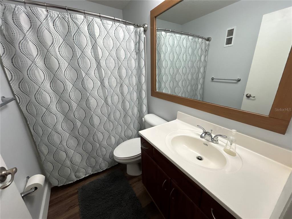 4912 25th Street West, Unit 102 Bradenton, FL 34207 - Photo 9 of 12 a bathroom with a sink toilet and shower