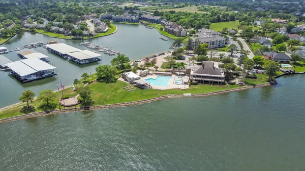 an aerial view of a house with a lake view