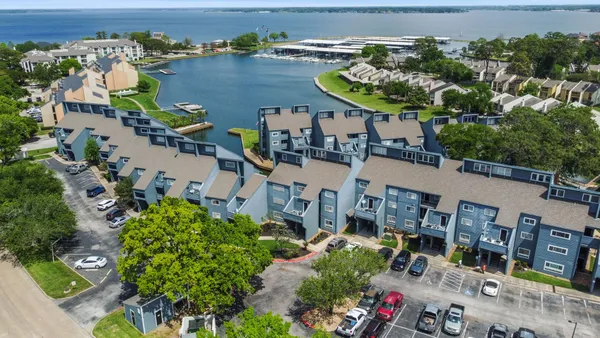 an aerial view of a house with a lake view
