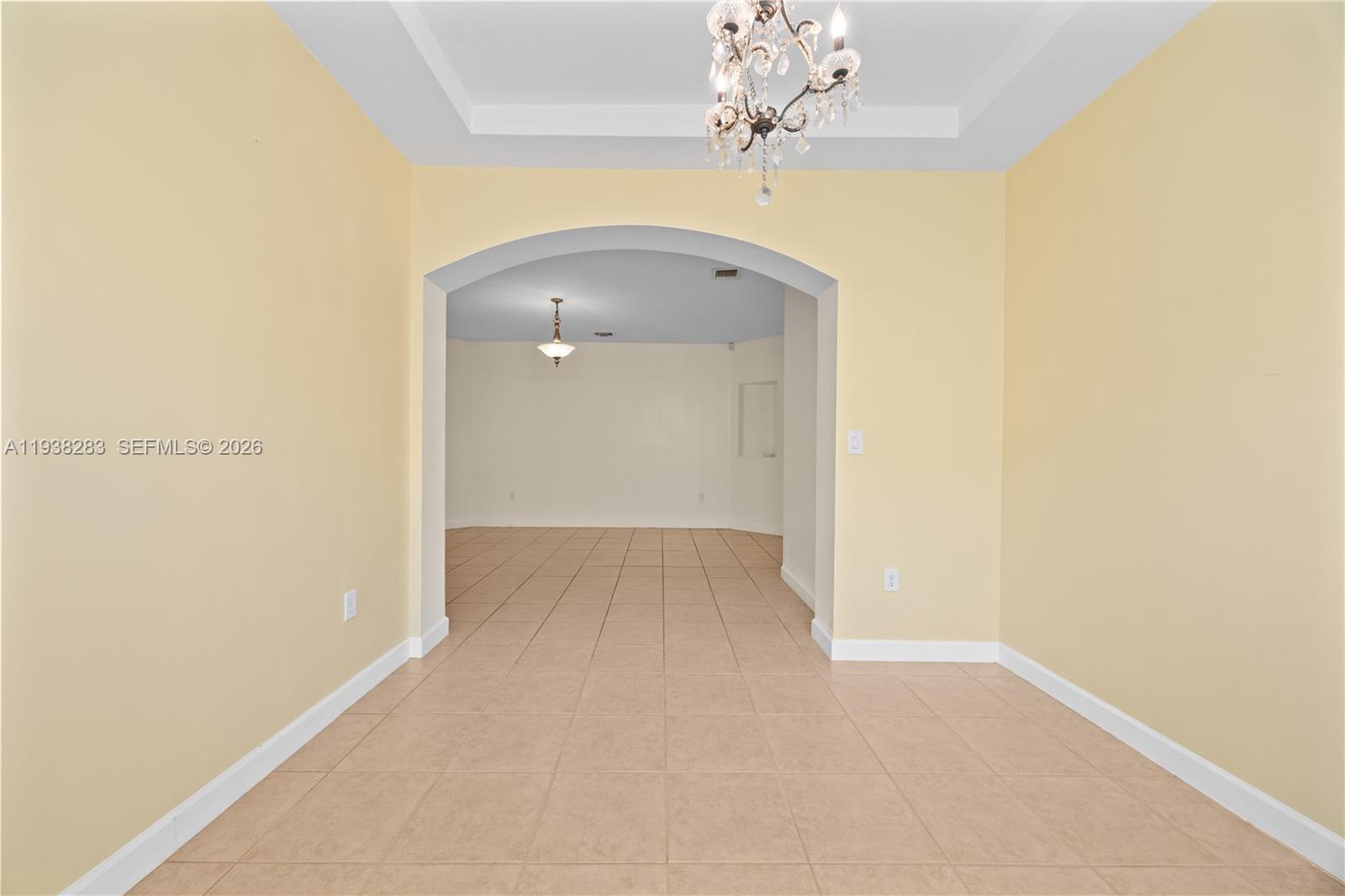 10770 Southwest 245th Street Homestead, FL 33032 - Photo 12 of 47 View of the living room from the dining room.