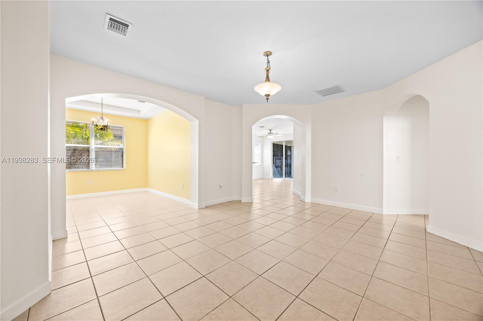 10770 Southwest 245th Street Homestead, FL 33032 - Photo 13 of 47 View of Dining room and Kitchen entrance from the living room.