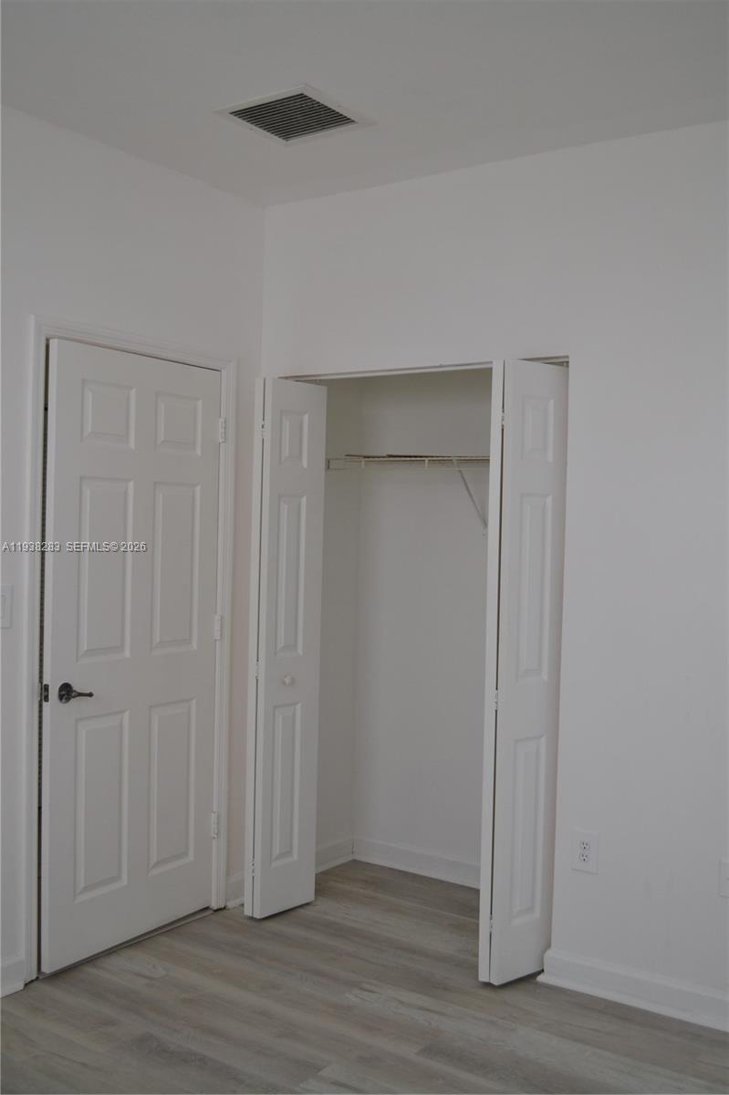 10770 Southwest 245th Street Homestead, FL 33032 - Photo 20 of 47 Second bedroom wall to wall closet.