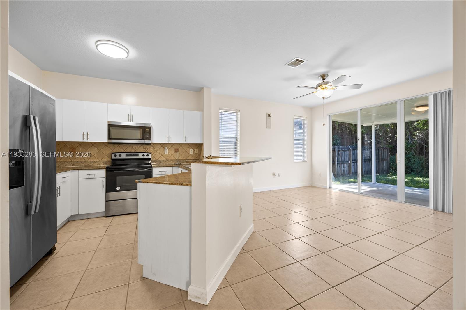 10770 Southwest 245th Street Homestead, FL 33032 - Photo 33 of 47 Kitchen and family room.
