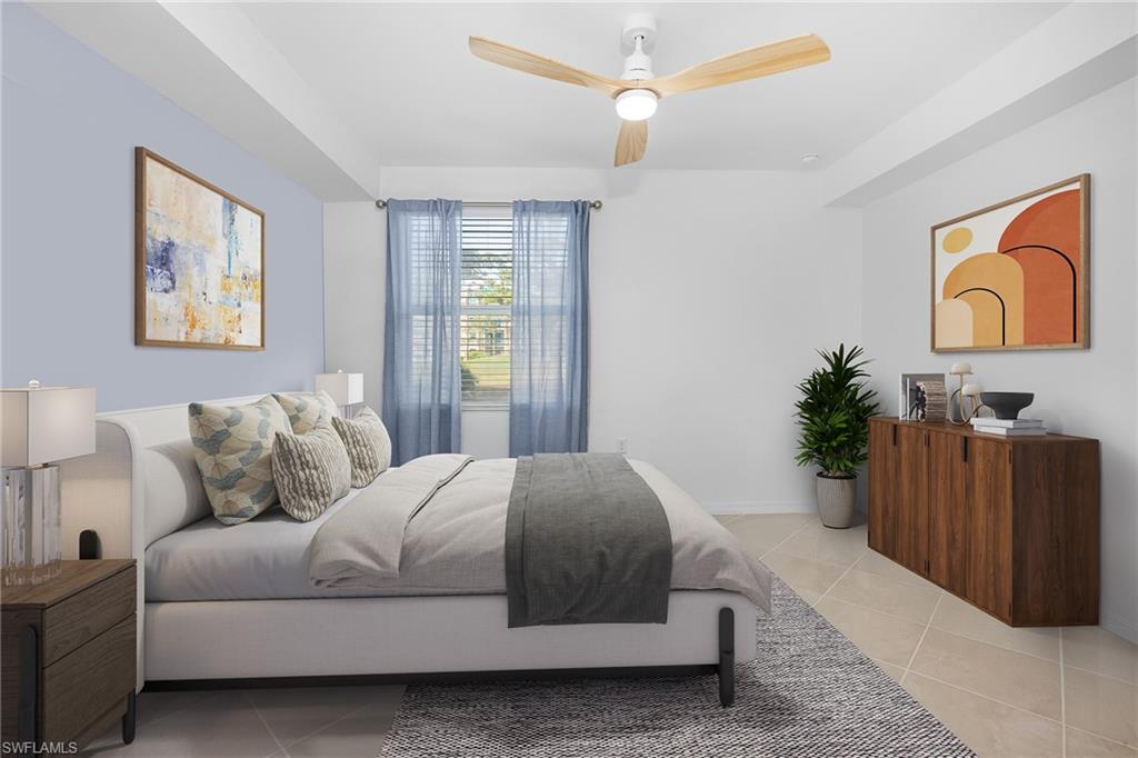 18461 Copperhead Drive, Unit 418 Lehigh Acres, FL 33936 - Photo 13 of 33 Bedroom featuring light tile patterned flooring and a ceiling fan