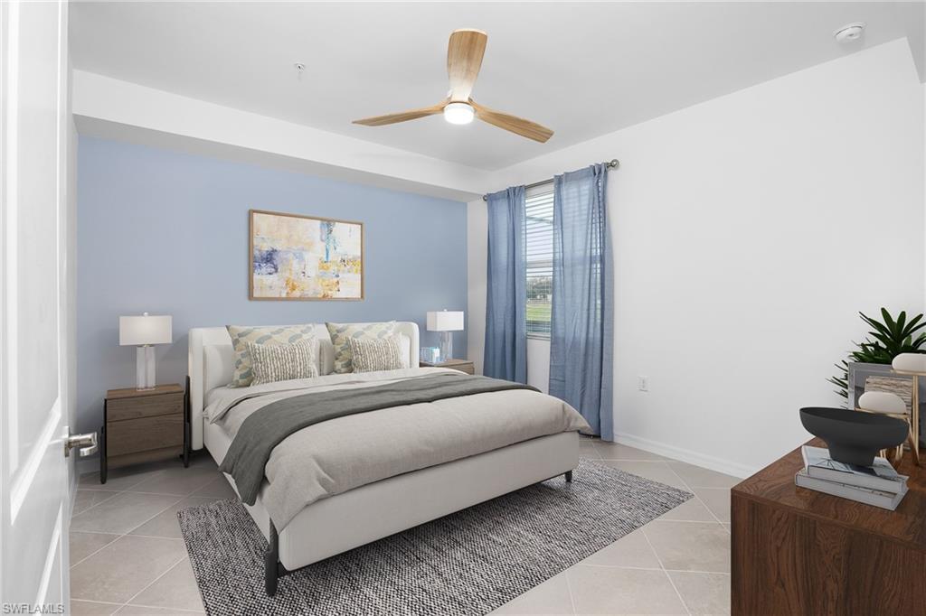 18461 Copperhead Drive, Unit 418 Lehigh Acres, FL 33936 - Photo 14 of 33 Bedroom featuring light tile patterned floors and ceiling fan