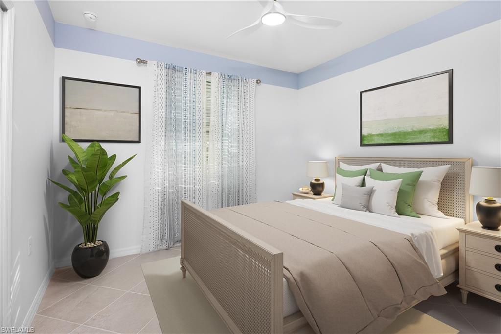 18461 Copperhead Drive, Unit 418 Lehigh Acres, FL 33936 - Photo 17 of 33 Bedroom featuring light tile patterned floors and ceiling fan