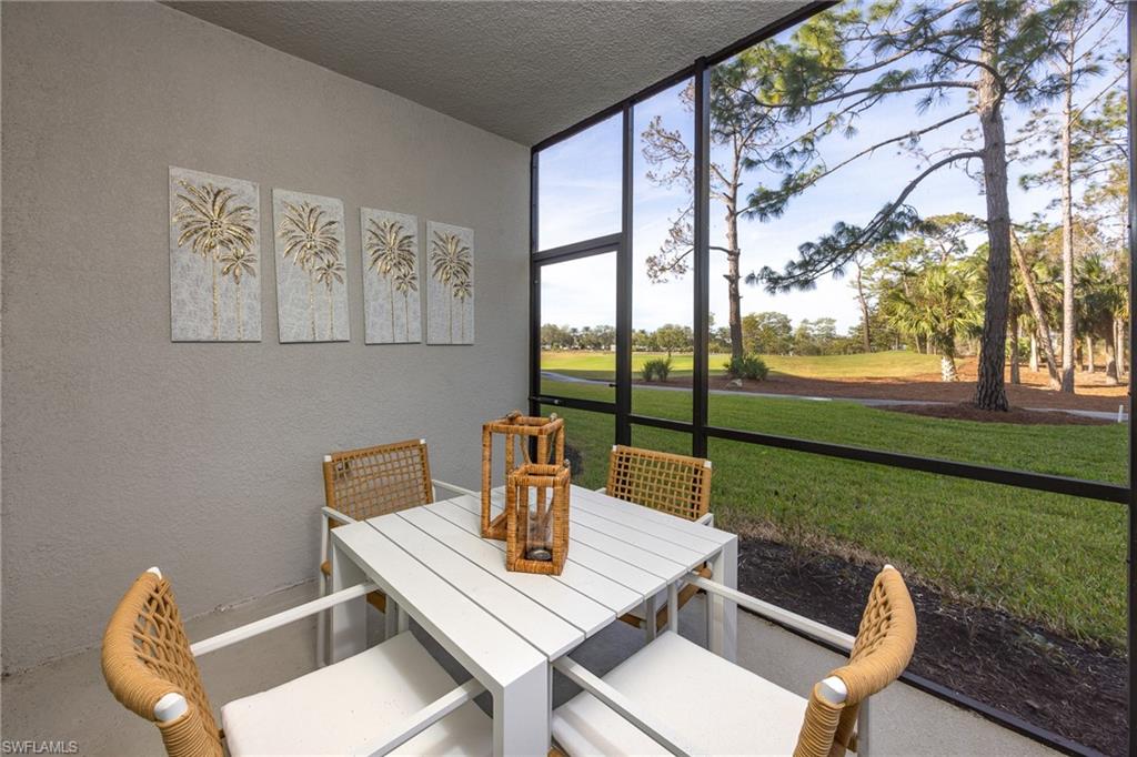 18461 Copperhead Drive, Unit 418 Lehigh Acres, FL 33936 - Photo 21 of 33 Sunroom / solarium featuring outdoor dining area