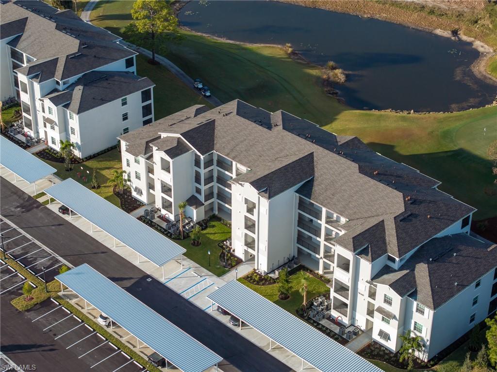 18461 Copperhead Drive, Unit 418 Lehigh Acres, FL 33936 - Photo 25 of 33 Bird's eye view of a nearby body of water and a golf club