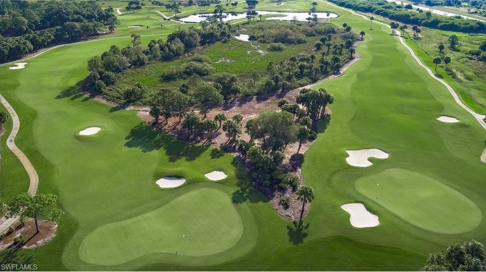 18461 Copperhead Drive, Unit 418 Lehigh Acres, FL 33936 - Photo 30 of 33 Aerial view of property's location with a golf club and a large body of water