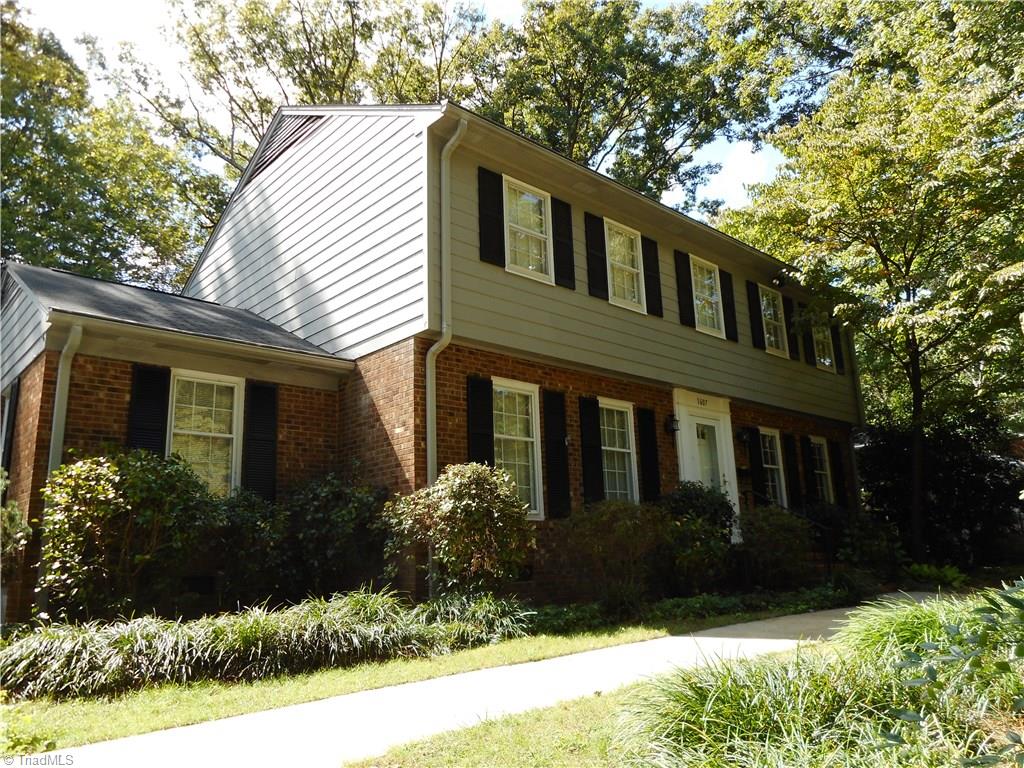 1607 Milan Road Greensboro, NC 27410 - Photo 1 of 22 Privacy in the front and the back with mature trees.