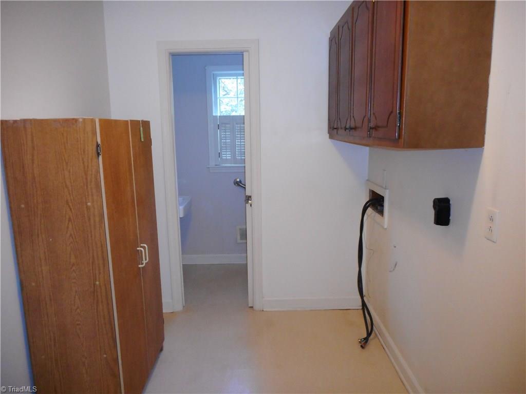 1607 Milan Road Greensboro, NC 27410 - Photo 18 of 22 Laundry room and half bath on main floor with back porch entrance.