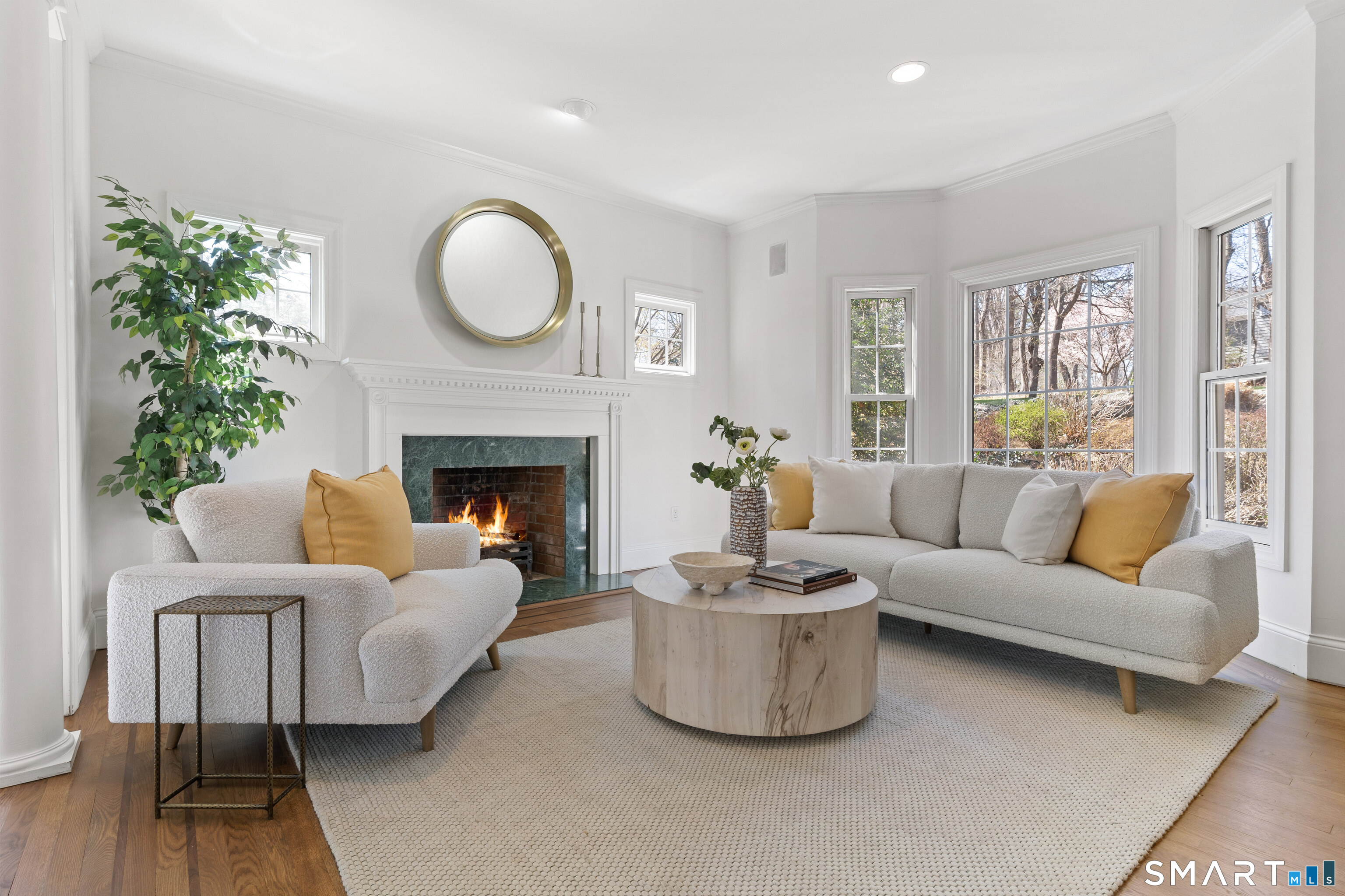 350 Chestnut Hill Road Norwalk, CT 06851 - Photo 11 of 37 Living room with bay window and wood-burning fireplace.