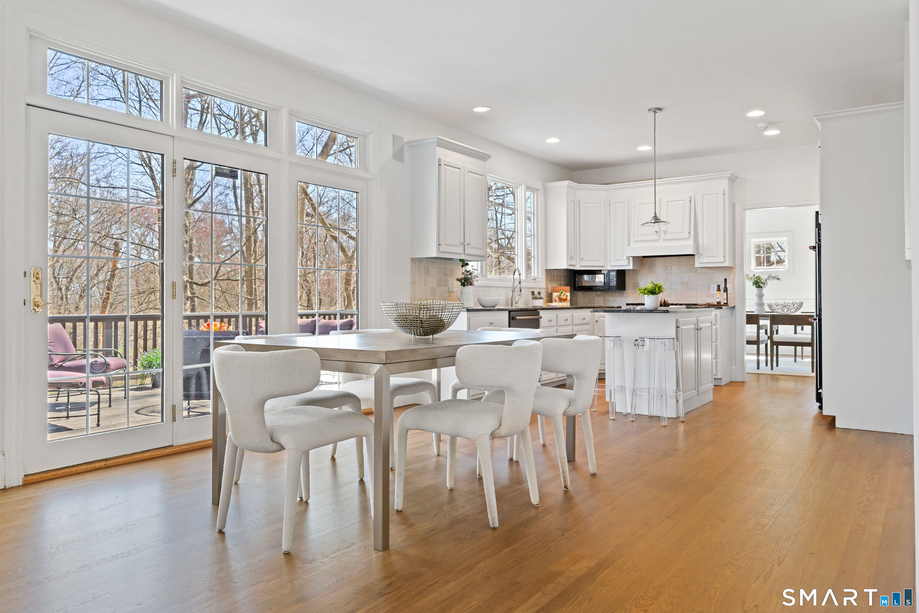 350 Chestnut Hill Road Norwalk, CT 06851 - Photo 14 of 37 Sunny dining area in kitchen opens onto huge deck overlooking the natural property.