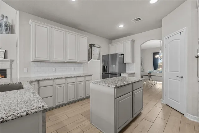 a kitchen with a sink stove and refrigerator