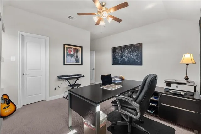 a view of a workspace with furniture