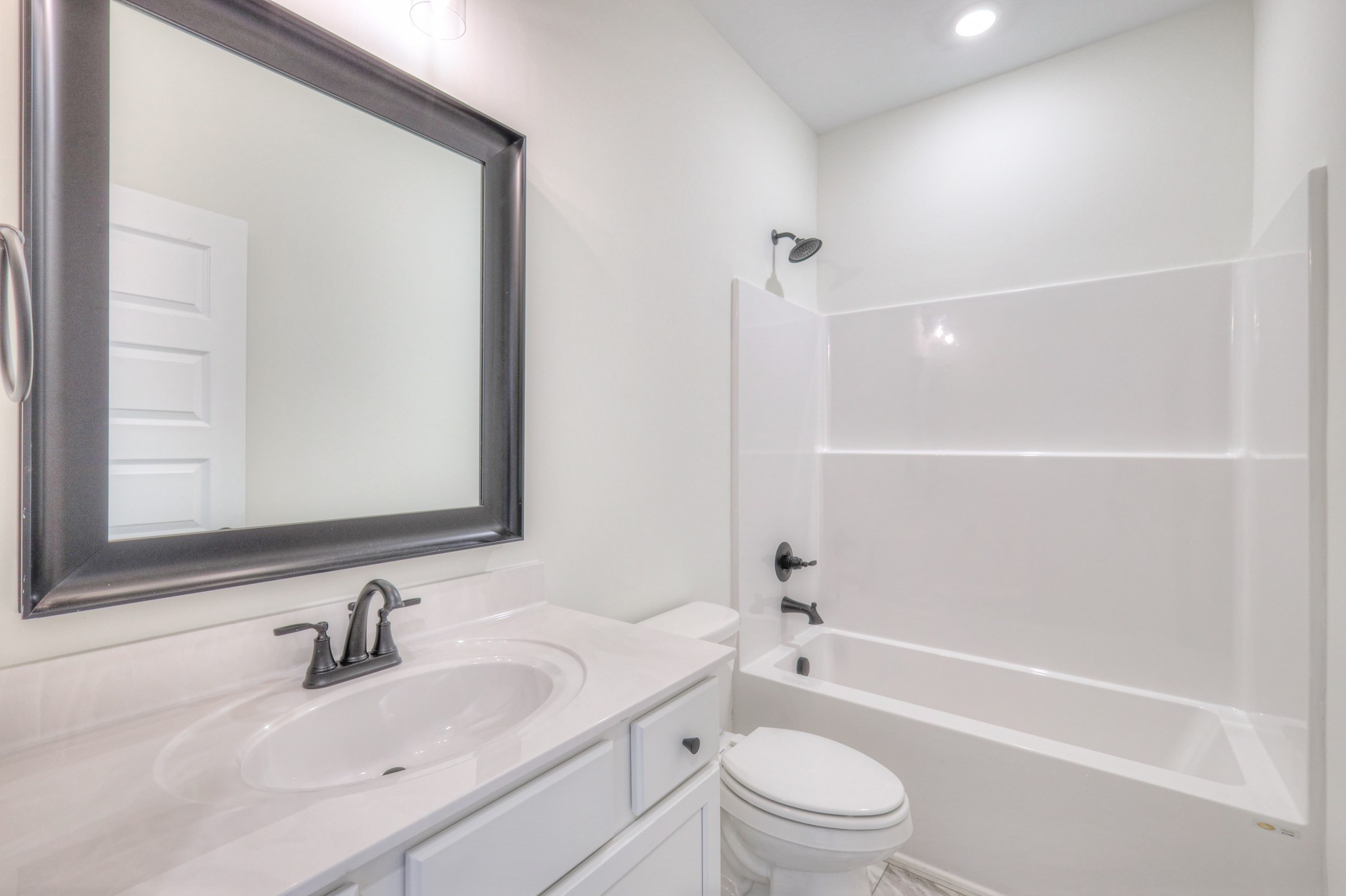 608 Phoebe Way Gallatin, TN 37066 - Photo 29 of 40 a bathroom with a bathtub shower sink vanity mirror and toilet