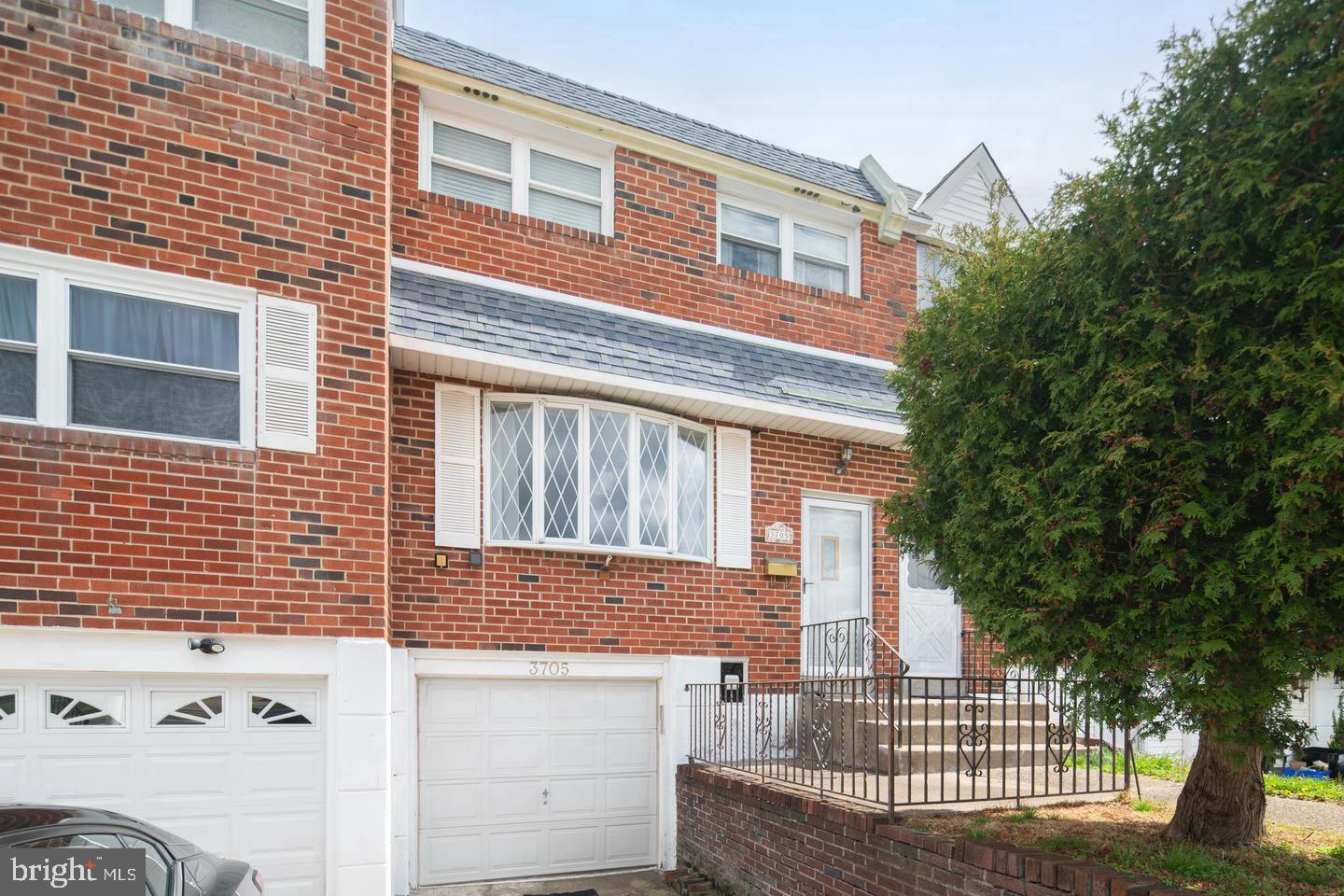 Charming brick facade with inviting entry.