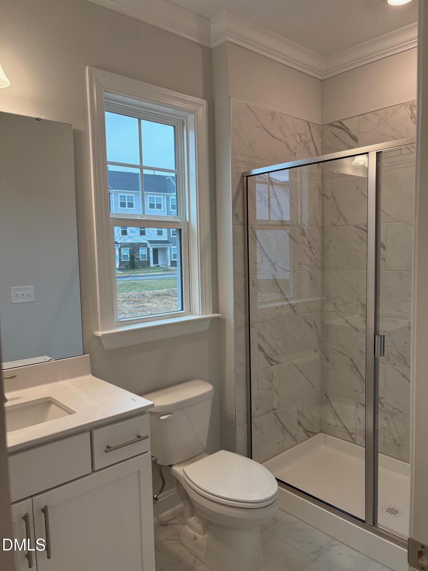 136 Corapeake Way Apex, NC 27539 - Photo 8 of 27 a bathroom with a shower toilet and sink