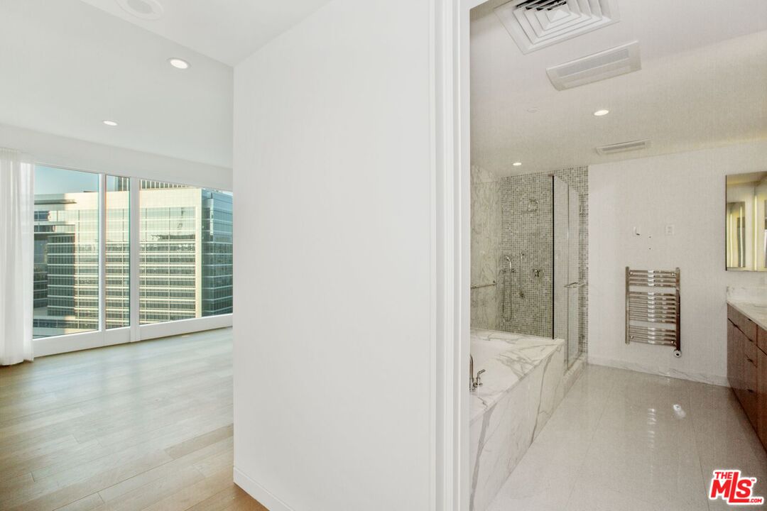 1 West Century Drive, Unit 8D Los Angeles, CA 90067 - Photo 11 of 12 a view of an empty room with a sliding door