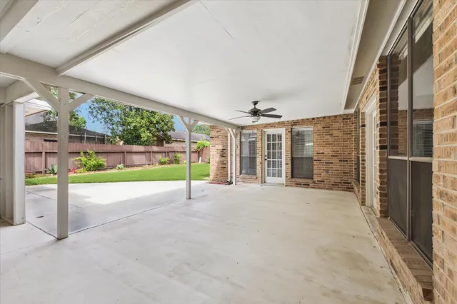 a view of a garden with an outdoor seating