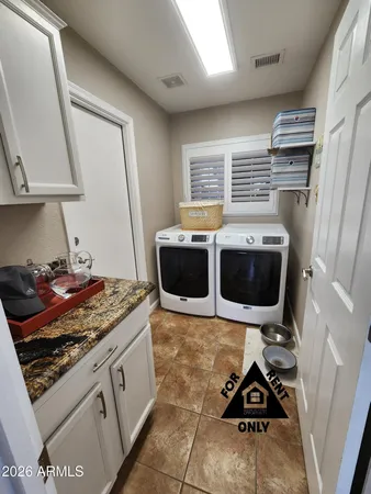 a view of a patio with table and chairs potted plants