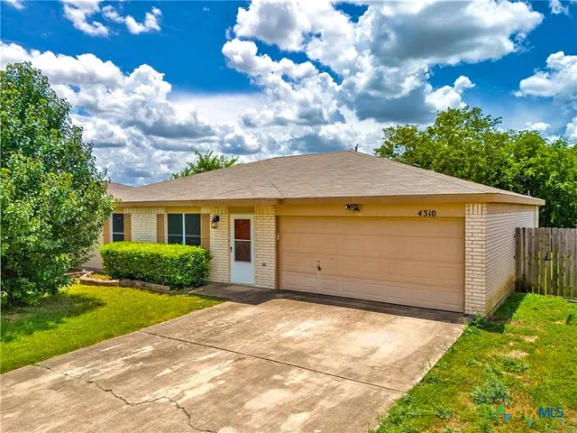 a view of a house with a garden